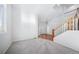 Spacious living room with hardwood floors, staircase, and open layout at 18150 Bolero Dr, Parker, CO 80134