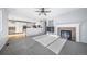 Living room with fireplace flows into kitchen with island and eat in space, great for entertaining at 18150 Bolero Dr, Parker, CO 80134
