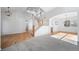 Open-concept living room featuring a staircase, hardwood floors, and ample natural light at 18150 Bolero Dr, Parker, CO 80134