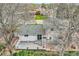 Aerial view of the backyard with a large deck and mature trees at 6458 W Clifton Pl, Littleton, CO 80128