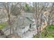An aerial view of a home showcasing the backyard deck, lush lawn, and mature trees at 6458 W Clifton Pl, Littleton, CO 80128