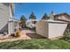 Well-maintained backyard with a storage shed, trailer parking and brick patio at 6458 W Clifton Pl, Littleton, CO 80128