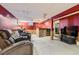 Finished basement with comfortable seating and a bar area, perfect for entertaining at 6458 W Clifton Pl, Littleton, CO 80128