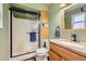 Bathroom featuring a shower, toilet and vanity with a sink and granite countertop at 6458 W Clifton Pl, Littleton, CO 80128