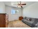 Comfortable bedroom with carpet, ceiling fan, window, and furniture at 6458 W Clifton Pl, Littleton, CO 80128
