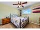 Bright bedroom with carpet, ceiling fan, a window with a view, and furniture at 6458 W Clifton Pl, Littleton, CO 80128