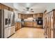 Spacious kitchen with stainless steel appliances and beautiful wood cabinets at 6458 W Clifton Pl, Littleton, CO 80128