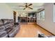 Cozy living room with a brick fireplace and large windows for natural light at 6458 W Clifton Pl, Littleton, CO 80128
