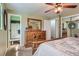 Main bedroom featuring carpet, ceiling fan, and dresser at 6458 W Clifton Pl, Littleton, CO 80128