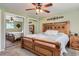 Main bedroom featuring carpet, ceiling fan, and mirrored closet doors at 6458 W Clifton Pl, Littleton, CO 80128