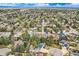 Neighborhood shot with mature trees; homes with solar panels at 6458 W Clifton Pl, Littleton, CO 80128