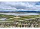 Aerial view showing a neighborhood with a lake nearby, offering scenic views at 6458 W Clifton Pl, Littleton, CO 80128