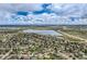 Aerial view of neighborhood near a lake, offering convenient highway access and city views at 6458 W Clifton Pl, Littleton, CO 80128