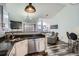 Charming kitchen features granite countertops, stainless steel appliances, and wood-look vinyl flooring at 3252 E 103Rd Dr # 708, Denver, CO 80229