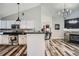 Modern kitchen with stainless steel appliances, granite countertops, and an open floor plan at 3252 E 103Rd Dr # 708, Denver, CO 80229