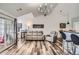 Open floor plan with modern furnishings, wood floors, and a sliding glass door at 3252 E 103Rd Dr # 708, Denver, CO 80229