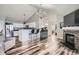 Living room showcasing modern open layout, fireplace, and kitchen with bar seating at 3252 E 103Rd Dr # 708, Denver, CO 80229