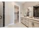 Modern bathroom features a double vanity, quartz countertops, and a walk-in closet at 423 Basin Daisy St, Castle Rock, CO 80104