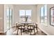 Bright dining area features modern décor, hardwood floors, and abundant natural light at 423 Basin Daisy St, Castle Rock, CO 80104