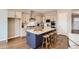 Spacious kitchen with island, pendant lighting, modern appliances, and ample storage at 423 Basin Daisy St, Castle Rock, CO 80104