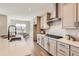 Modern kitchen features stainless steel appliances, gas cooktop, custom cabinets, and hardwood floors at 423 Basin Daisy St, Castle Rock, CO 80104