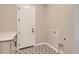 Laundry room featuring patterned flooring, white cabinets, and hookups for a washer and dryer at 423 Basin Daisy St, Castle Rock, CO 80104