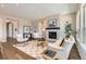 Bright living room features a fireplace, hardwood floors, and neutral decor at 423 Basin Daisy St, Castle Rock, CO 80104