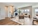 Stylish living room with a fireplace, hardwood floors, and large windows at 423 Basin Daisy St, Castle Rock, CO 80104