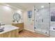 Bright bathroom with a glass shower, vanity, ample space, natural light, and minimalist design at 8898 Chestnut Hill Ct, Highlands Ranch, CO 80130