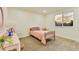 Bright bedroom with cozy carpet, a window and a bed with pink accents at 8898 Chestnut Hill Ct, Highlands Ranch, CO 80130