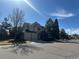 Spacious two-story home with a two-car garage and an expansive driveway on a clear day at 8898 Chestnut Hill Ct, Highlands Ranch, CO 80130