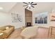 Bright living room with a modern fireplace, vaulted ceilings, and large windows for natural light at 8898 Chestnut Hill Ct, Highlands Ranch, CO 80130