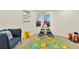 Cozy playroom with playful alphabet rug, teepee, and bright decor at 8898 Chestnut Hill Ct, Highlands Ranch, CO 80130