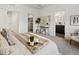 Bright bedroom with neutral decor, carpeted floors, and stylish furniture with doorways leading to a bathroom and closet at 4539 Tabor St, Wheat Ridge, CO 80033