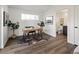 Bright home office with a modern desk, stylish decor, and a view into the bathroom at 4539 Tabor St, Wheat Ridge, CO 80033