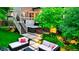 Private backyard featuring a deck with hot tub and outdoor seating on a stone patio at 5150 Morning Glory Pl, Highlands Ranch, CO 80130