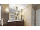Elegant bathroom with double vanity, modern lighting, and stylish mirrors for a luxurious feel at 5150 Morning Glory Pl, Highlands Ranch, CO 80130