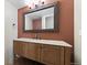 Stylish half-bathroom featuring a granite countertop and warm wall tones, perfect for guests at 5150 Morning Glory Pl, Highlands Ranch, CO 80130