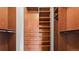 Spacious walk-in closet with custom shelving, drawers, and ample storage for clothing and accessories at 5150 Morning Glory Pl, Highlands Ranch, CO 80130