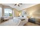 Serene main bedroom with vaulted ceiling, large window, and cozy seating, offering a relaxing retreat at 5150 Morning Glory Pl, Highlands Ranch, CO 80130