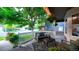 Inviting front porch with comfortable seating, decorative plants, and a cozy atmosphere for outdoor relaxation at 5150 Morning Glory Pl, Highlands Ranch, CO 80130