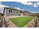 The backyard features artificial turf, a concrete patio, and low-maintenance gravel landscaping at 2159 Indian Balsam Dr, Monument, CO 80132