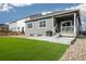 A well-maintained backyard with artificial turf, a concrete patio, and gravel landscaping, perfect for outdoor enjoyment at 2159 Indian Balsam Dr, Monument, CO 80132