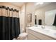 Clean bathroom with a shower-tub combo and classic vanity at 2159 Indian Balsam Dr, Monument, CO 80132