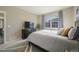 Cozy bedroom with a large window offering natural light and neighborhood views at 2159 Indian Balsam Dr, Monument, CO 80132