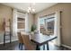 Dining room featuring a wooden table with upholstered chairs and a sliding glass door at 2159 Indian Balsam Dr, Monument, CO 80132