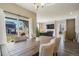 Dining area with view to a living room with fireplace and mounted TV at 2159 Indian Balsam Dr, Monument, CO 80132