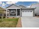Beautiful home featuring a two-car garage and manicured lawn at 2159 Indian Balsam Dr, Monument, CO 80132