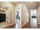 Hallway with hard wood floors leads to bath, living room, and other rooms at 2159 Indian Balsam Dr, Monument, CO 80132