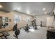 Well-lit home gym equipped with weightlifting and cardio equipment at 2159 Indian Balsam Dr, Monument, CO 80132